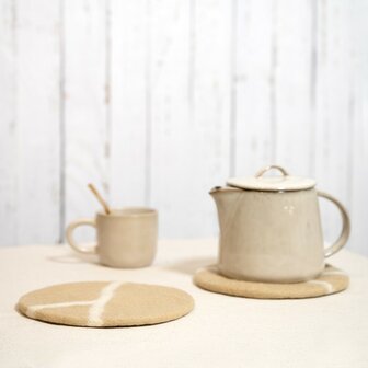 Beige onderzetters 20cm Fairtrade van Sjaal met Verhaal